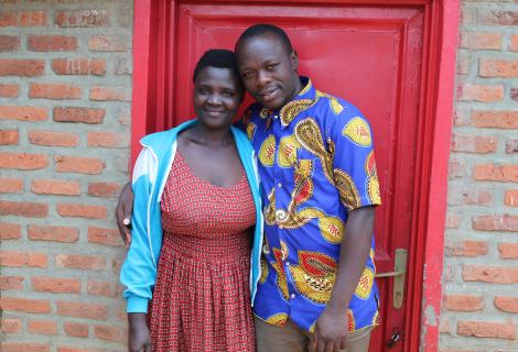 Kanyamugenge and his wife,Nyirasafari cheerefully pose for a photo together 