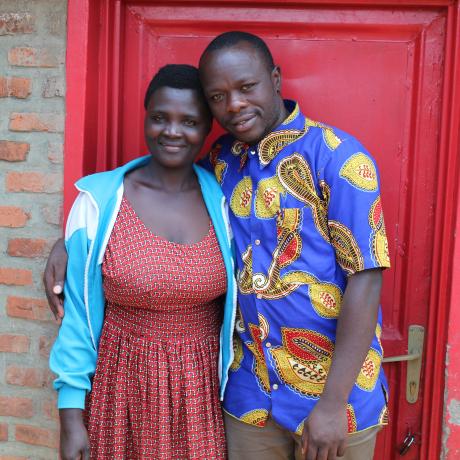 Kanyamugenge and his wife,Nyirasafari cheerefully pose for a photo together 
